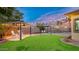 Spacious backyard oasis with two gazebos and lawn at 21752 E Estrella Rd, Queen Creek, AZ 85142