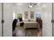 Bright bedroom with wood-look floors and en-suite bathroom access at 21752 E Estrella Rd, Queen Creek, AZ 85142
