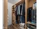 Large walk-in closet with shelving and hanging rods at 21752 E Estrella Rd, Queen Creek, AZ 85142