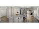 Open concept kitchen with island and access to Gathering room at 21752 E Estrella Rd, Queen Creek, AZ 85142