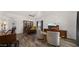 Bright and airy living area featuring a built-in bar and hardwood floors at 21752 E Estrella Rd, Queen Creek, AZ 85142
