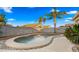 Kidney-shaped pool with a surrounding patio at 21752 E Estrella Rd, Queen Creek, AZ 85142