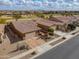 Single-story home with two-car garage, desert landscaping, and golf course views at 22 S Mesilla Ln, Casa Grande, AZ 85194