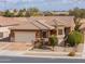 Single story home with a two car garage and desert landscaping at 22 S Mesilla Ln, Casa Grande, AZ 85194