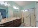 Large bathroom with double sinks and a walk-in shower at 22 S Mesilla Ln, Casa Grande, AZ 85194