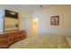 Bedroom with a dresser and large TV, offering comfort and convenience at 22 S Mesilla Ln, Casa Grande, AZ 85194