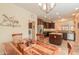 Dining area with wood table and chairs, open to kitchen at 22 S Mesilla Ln, Casa Grande, AZ 85194