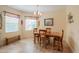 Bright dining area with wood table and chairs, near kitchen at 22 S Mesilla Ln, Casa Grande, AZ 85194