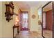 Bright entryway with tile flooring, a wooden console table, and a large mirror at 22 S Mesilla Ln, Casa Grande, AZ 85194