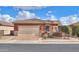 House exterior showcasing a two-car garage and well-maintained landscaping at 22 S Mesilla Ln, Casa Grande, AZ 85194
