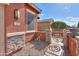 Front yard entry with a decorative metal gate and stonework at 22 S Mesilla Ln, Casa Grande, AZ 85194