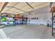 Well-organized garage with storage shelving and overhead door at 22 S Mesilla Ln, Casa Grande, AZ 85194