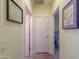 Bright hallway with light walls and tile flooring at 22 S Mesilla Ln, Casa Grande, AZ 85194