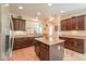Kitchen boasts an island, stainless steel appliances, and ample cabinetry at 22 S Mesilla Ln, Casa Grande, AZ 85194