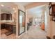 Open kitchen with dark cabinets, granite counters, and stainless steel appliances at 22 S Mesilla Ln, Casa Grande, AZ 85194