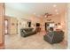 Spacious living room with leather sofas and access to patio at 22 S Mesilla Ln, Casa Grande, AZ 85194