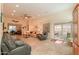 Living room with comfy seating, tile floors, and ceiling fan at 22 S Mesilla Ln, Casa Grande, AZ 85194