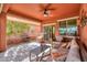 Comfortable covered patio with seating area, adjacent to the house at 22 S Mesilla Ln, Casa Grande, AZ 85194