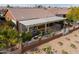 Backyard patio with pergola, grill, and lush landscaping at 22 S Mesilla Ln, Casa Grande, AZ 85194