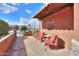 Relaxing patio featuring two chairs and a small table under an awning at 22 S Mesilla Ln, Casa Grande, AZ 85194