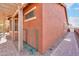 Side yard with a walkway and green cart storage at 22 S Mesilla Ln, Casa Grande, AZ 85194