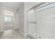 Bright bathroom featuring glass enclosed shower and wood-look flooring at 22831 N 183Rd Dr, Surprise, AZ 85387