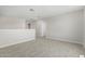 This bonus room features neutral carpet, white walls, and access to another room at 22831 N 183Rd Dr, Surprise, AZ 85387