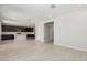 Spacious living room featuring hardwood floors and an open layout flowing into the modern kitchen at 22831 N 183Rd Dr, Surprise, AZ 85387