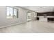 Open-concept layout showcasing tile flooring, large windows, a sliding glass door, and an eat-in kitchen at 22831 N 183Rd Dr, Surprise, AZ 85387