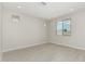 Bright living room with hard surface floors, recessed lighting, and view of exterior at 22831 N 183Rd Dr, Surprise, AZ 85387
