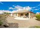 Backyard view of home with covered patio and landscaping at 26689 W Burnett Rd, Buckeye, AZ 85396