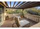 Private balcony with pergola, chairs and mountain views at 27256 N 97Th Pl, Scottsdale, AZ 85262