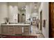 Elegant bathroom with double vanity, large mirror, and walk-in shower at 27256 N 97Th Pl, Scottsdale, AZ 85262