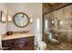 Elegant bathroom with a large walk-in shower and double vanity at 27256 N 97Th Pl, Scottsdale, AZ 85262