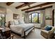 Bright bedroom with a comfortable bed and a window seat at 27256 N 97Th Pl, Scottsdale, AZ 85262