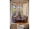 Bright dining room with large windows and a chandelier at 27256 N 97Th Pl, Scottsdale, AZ 85262