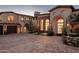 Luxury estate showcasing a grand facade and meticulously designed landscaping at 27256 N 97Th Pl, Scottsdale, AZ 85262