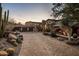 Grand estate with stone facade and large driveway at 27256 N 97Th Pl, Scottsdale, AZ 85262