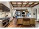 Modern kitchen with high-end appliances and rustic wood flooring at 27256 N 97Th Pl, Scottsdale, AZ 85262