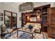 Charming library with built-in bookshelves and comfortable seating at 27256 N 97Th Pl, Scottsdale, AZ 85262