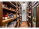 Walk-in pantry with ample shelving for storage at 27256 N 97Th Pl, Scottsdale, AZ 85262