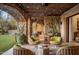Covered patio with comfortable seating and string lights at 27256 N 97Th Pl, Scottsdale, AZ 85262