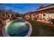 Expansive backyard with a freeform pool, spa, and outdoor entertaining area at 27256 N 97Th Pl, Scottsdale, AZ 85262