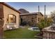 Landscaped side yard with trampoline and seating area at 27256 N 97Th Pl, Scottsdale, AZ 85262