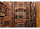 Large, well-stocked wine cellar with wooden racks at 27256 N 97Th Pl, Scottsdale, AZ 85262