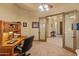 Home office with built-in wooden desk and cabinets at 28515 N 179Th Dr, Surprise, AZ 85387