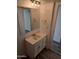 Bathroom boasts a vanity with white cabinets and a large mirror at 303 S Recker Rd # 126, Mesa, AZ 85206
