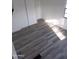 Bright bedroom featuring gray vinyl flooring and ample closet space at 303 S Recker Rd # 126, Mesa, AZ 85206