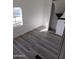 Well-lit bedroom with gray vinyl flooring and a closet at 303 S Recker Rd # 126, Mesa, AZ 85206