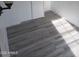 Spacious bedroom with light grey wood-look flooring at 303 S Recker Rd # 126, Mesa, AZ 85206